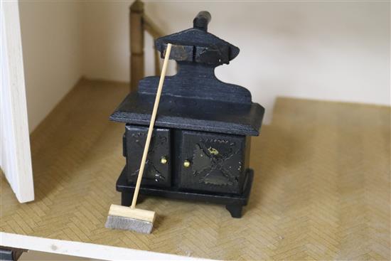 A modern dolls house with furniture W.56cm
